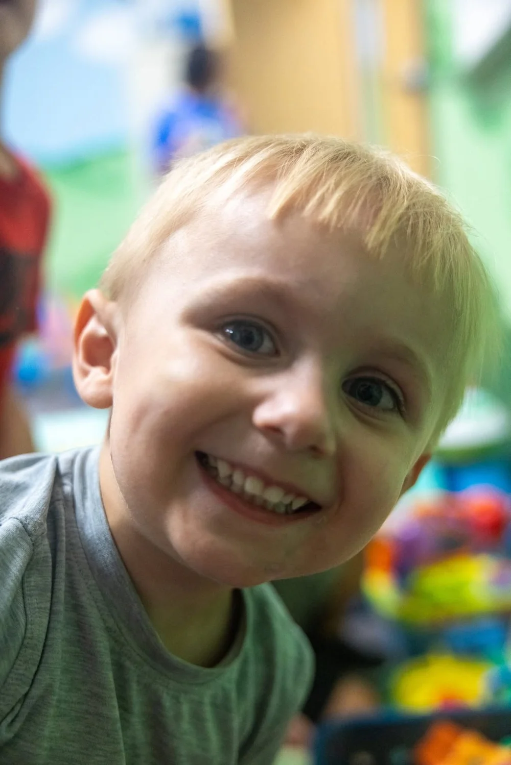 A young boy smiling