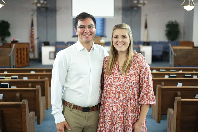 A couple smiling in the sanctuary