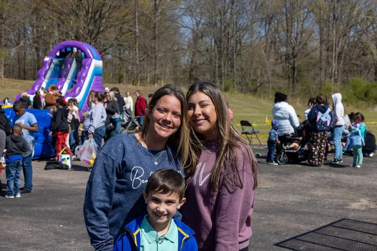 Moms and a boy at the Easter egg hunt