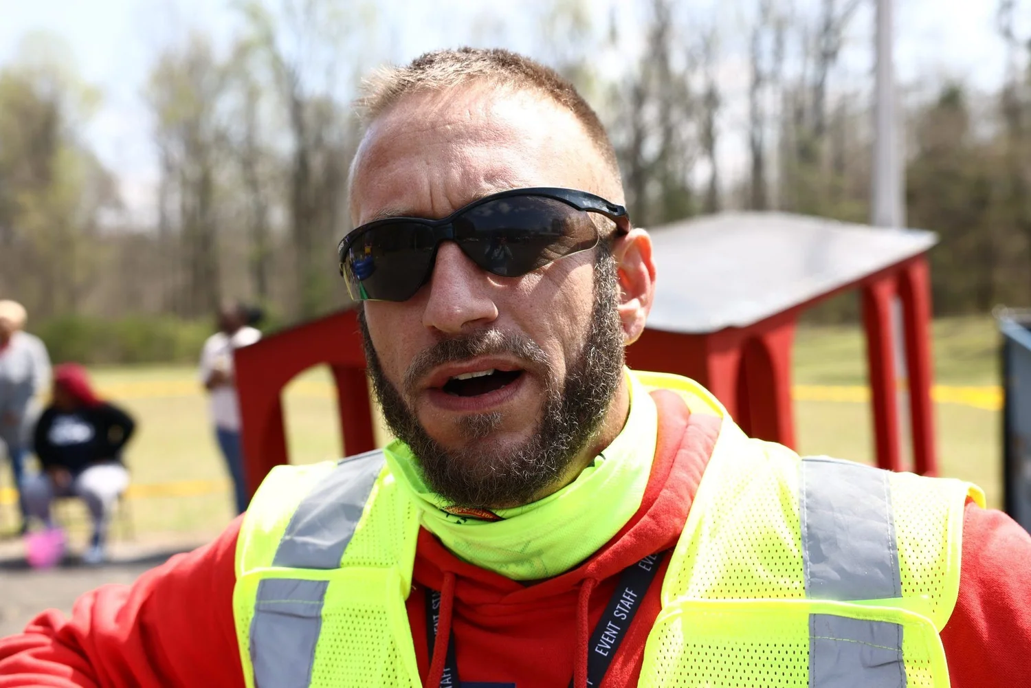 A volunteer in a safety vest