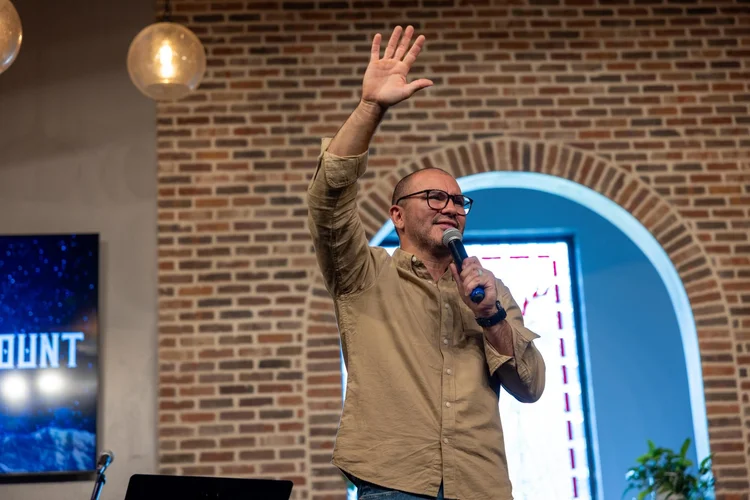 Pastor Simon preaching