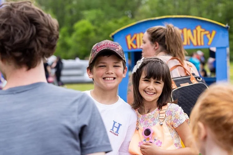 Kids riding the barrel train at Easter