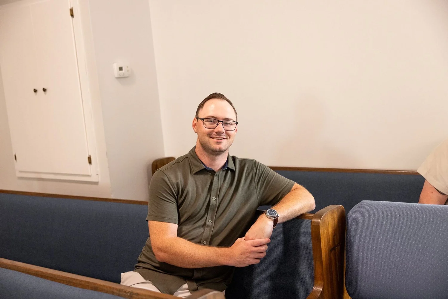 A young man sitting in the sanctuary