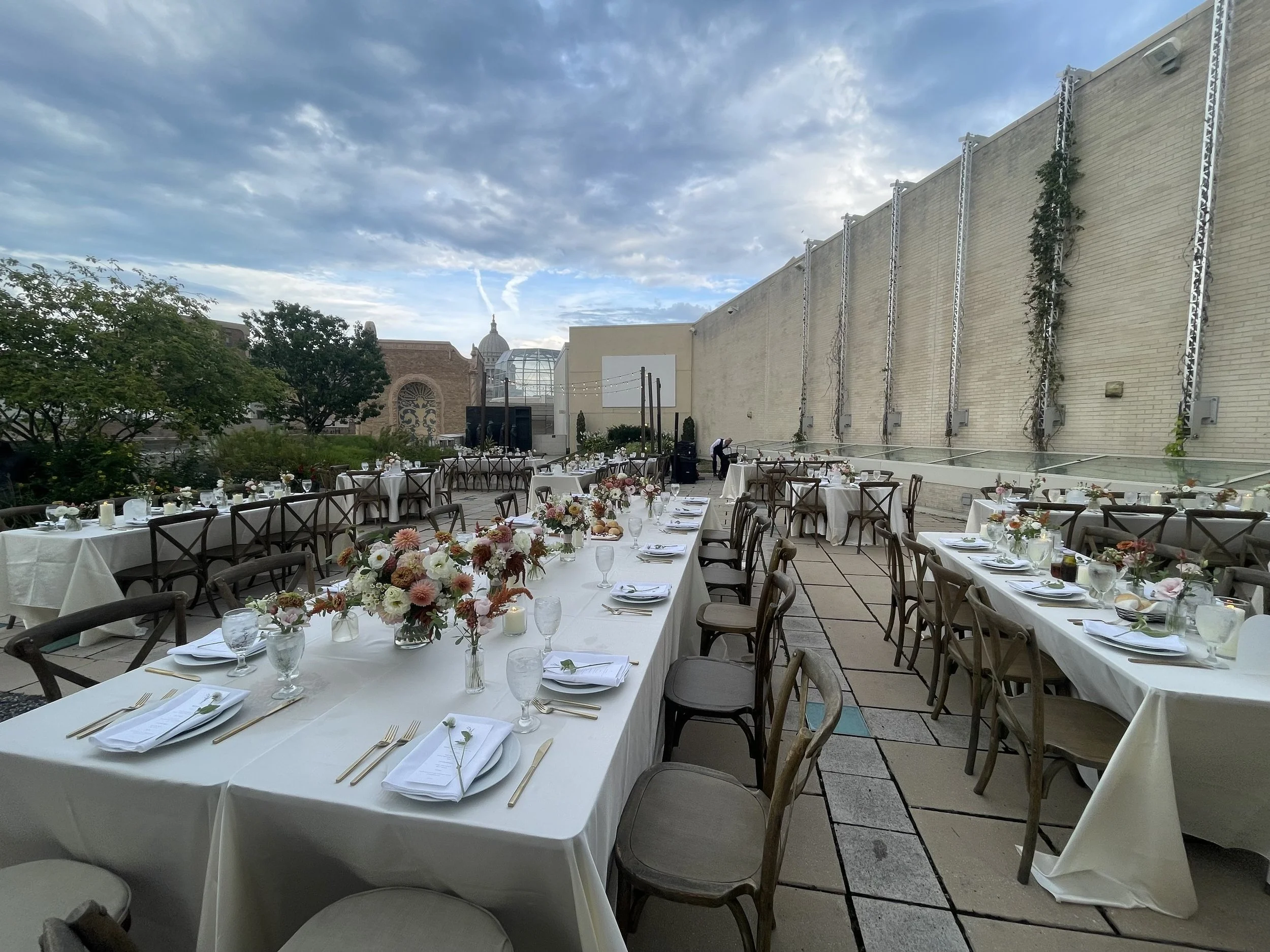 A long outdoor table by Pollen and Platter