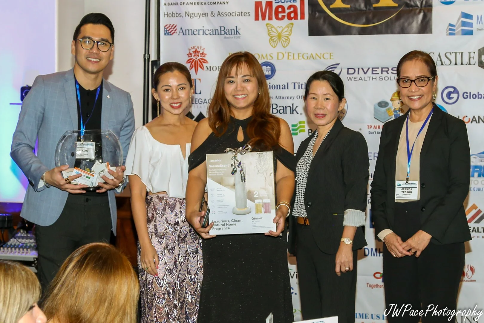 Team collaborating around laptops