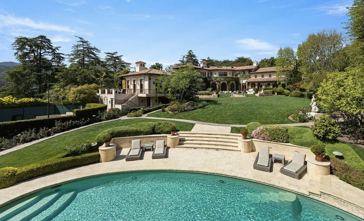 Italian-style villa with formal gardens, lawn and pool