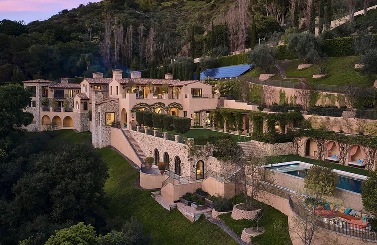 Sprawling Mediterranean hillside estate with terraced gardens and pool