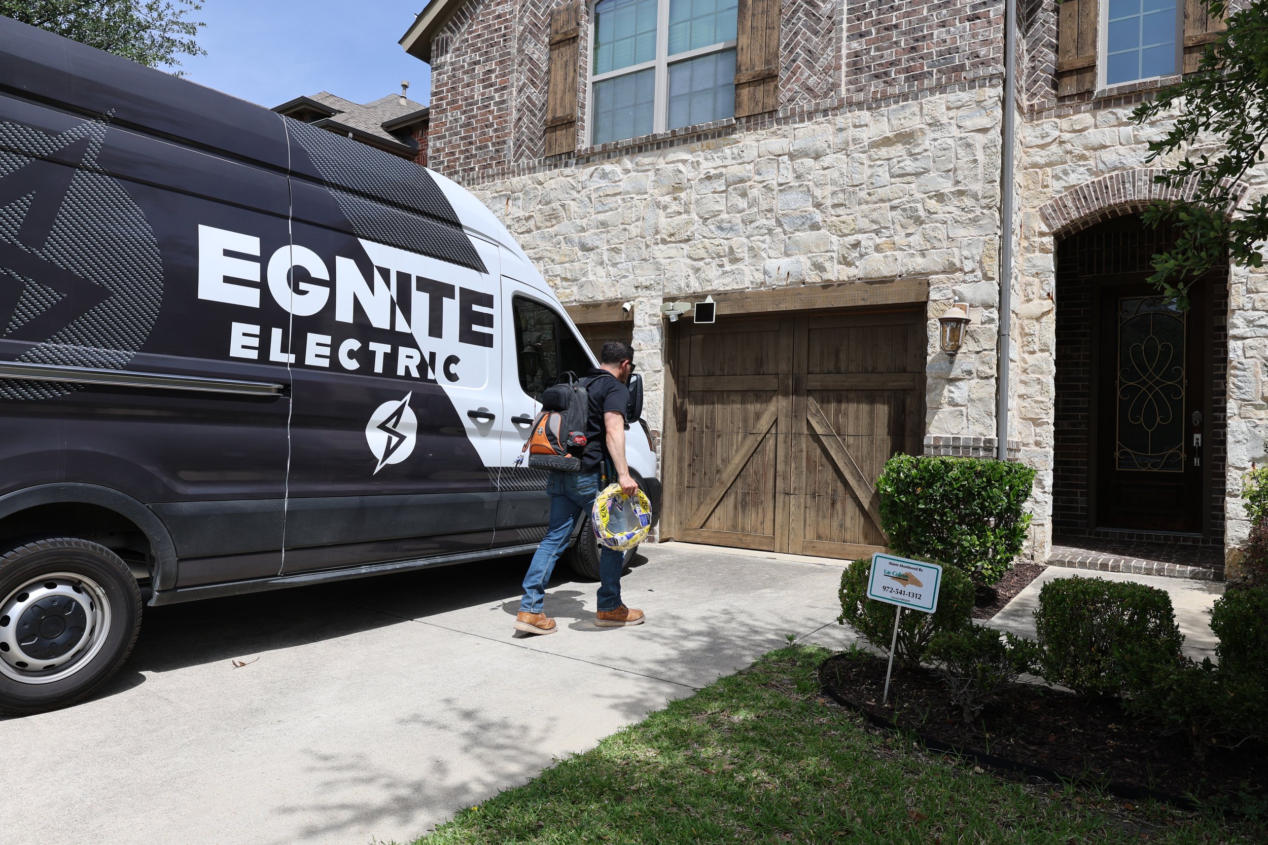 Egnite Electric technician arriving at residential property