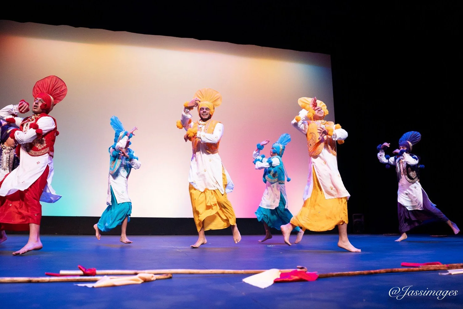 CVB live team performing traditional folk Bhangra in colorful costumes