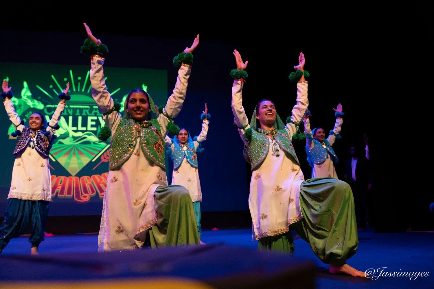 CVB dancers celebrating their performance together on stage