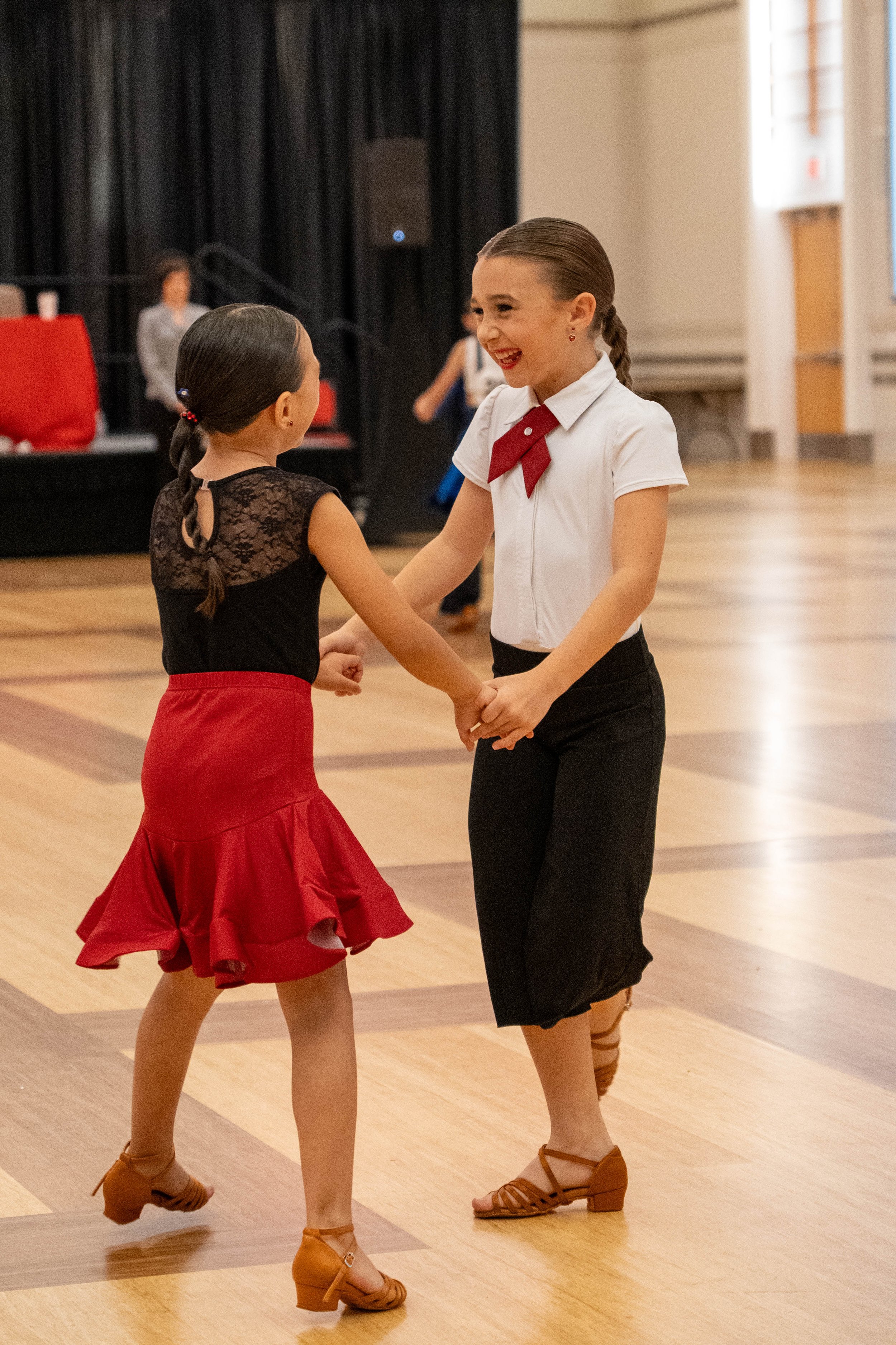 Young girls partnered dancing