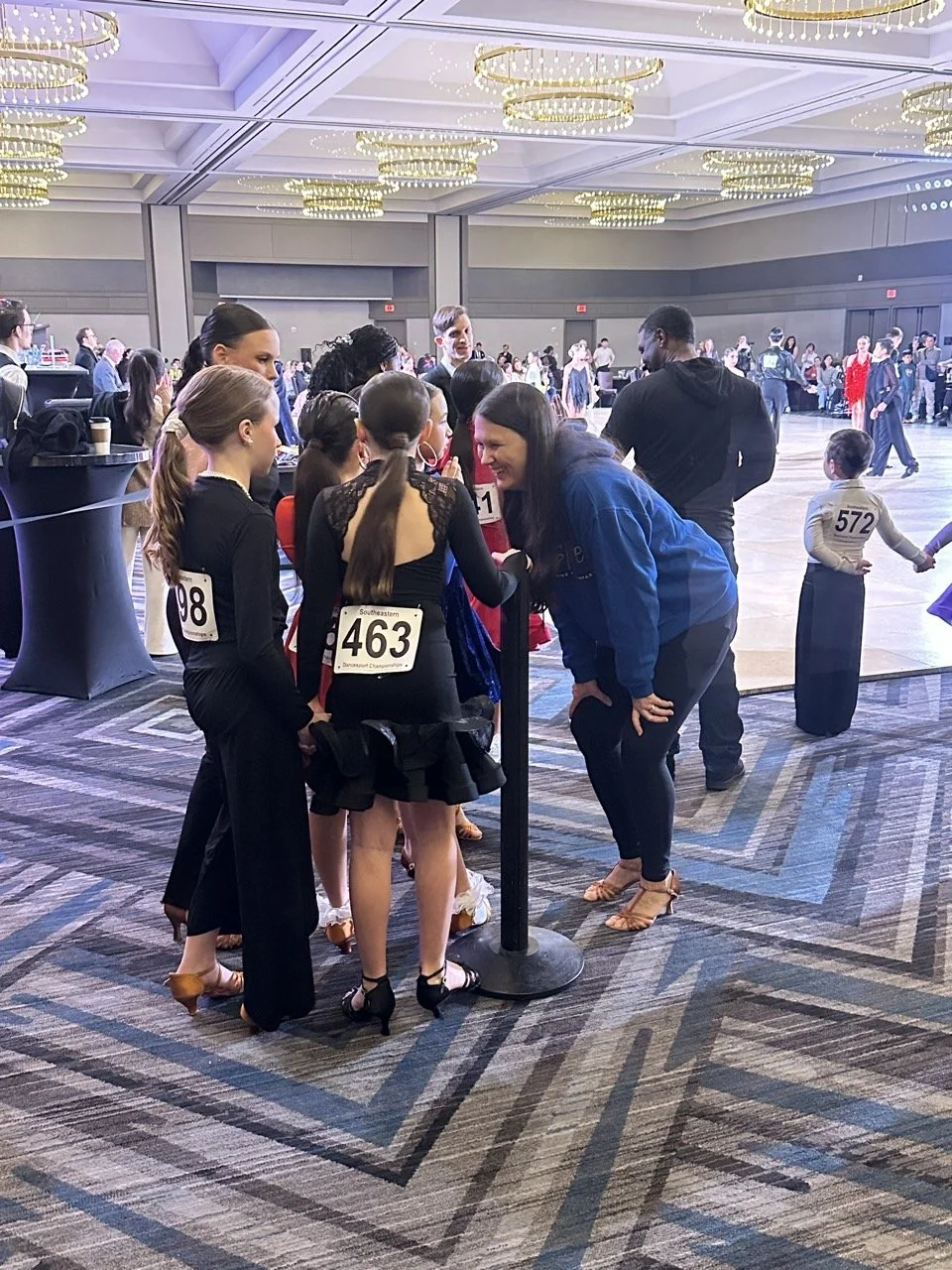 Coach with students at competition