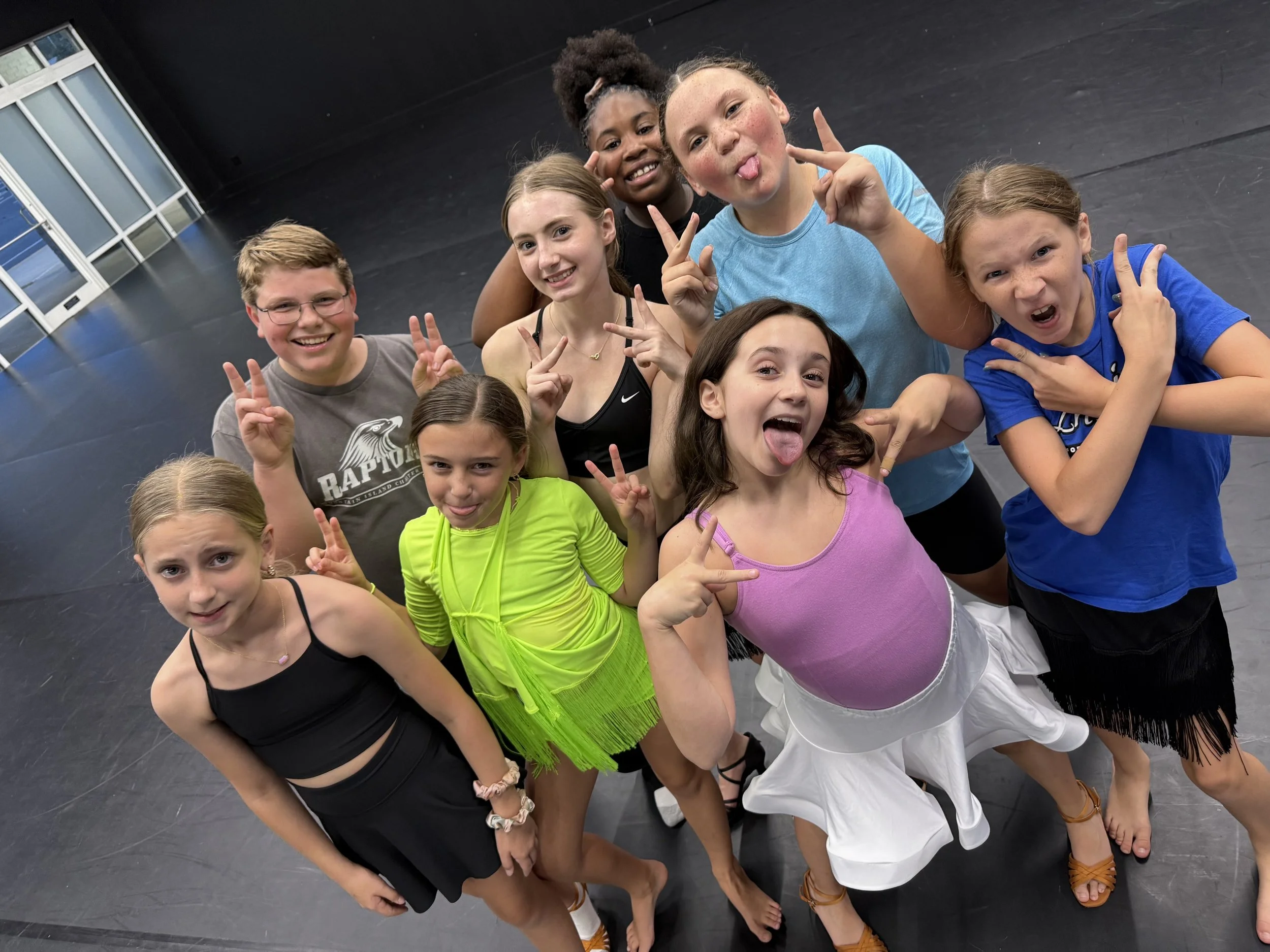 Kids in studio making peace signs