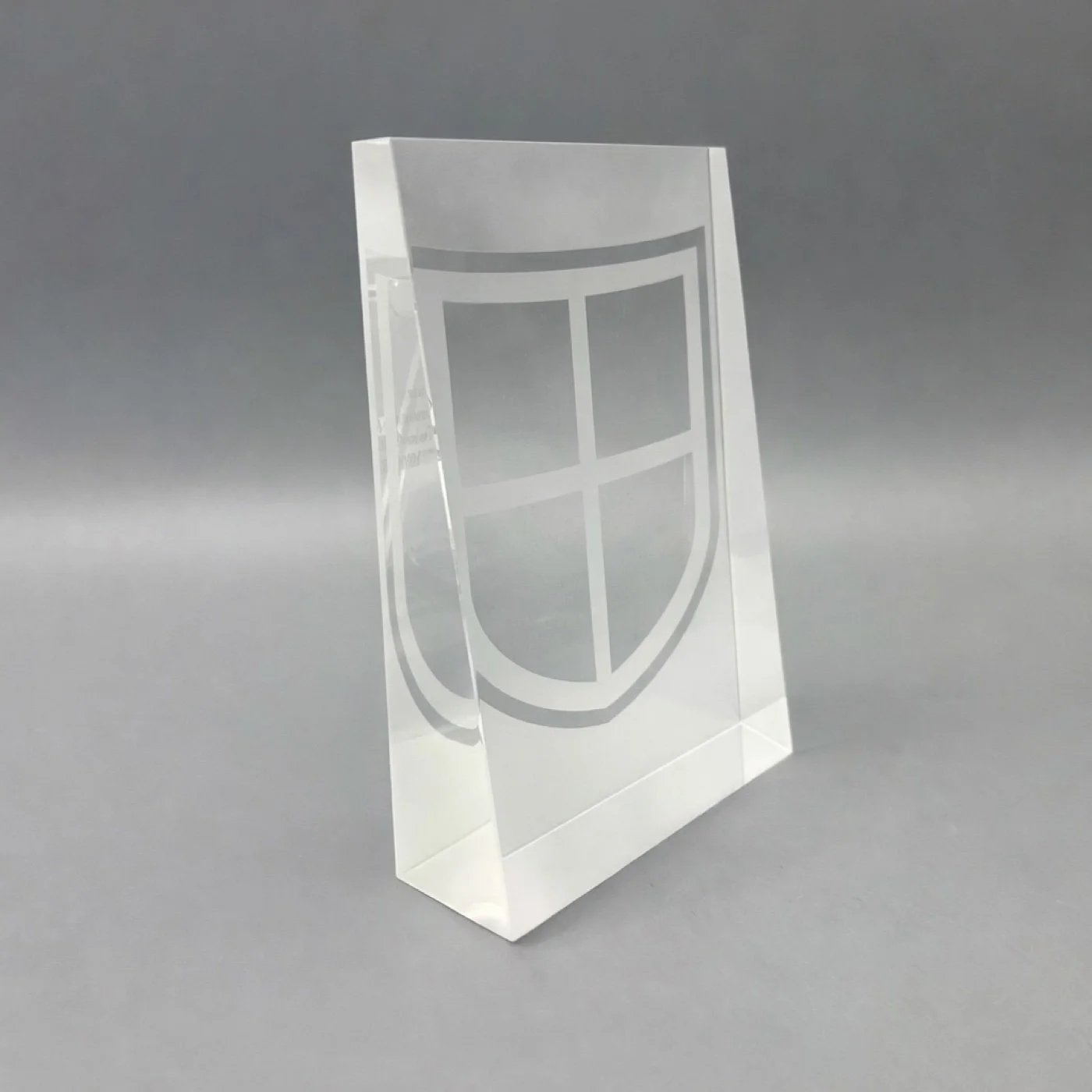 Classic clear rectangular deal marker with an etched shield motif, shown at an angle.