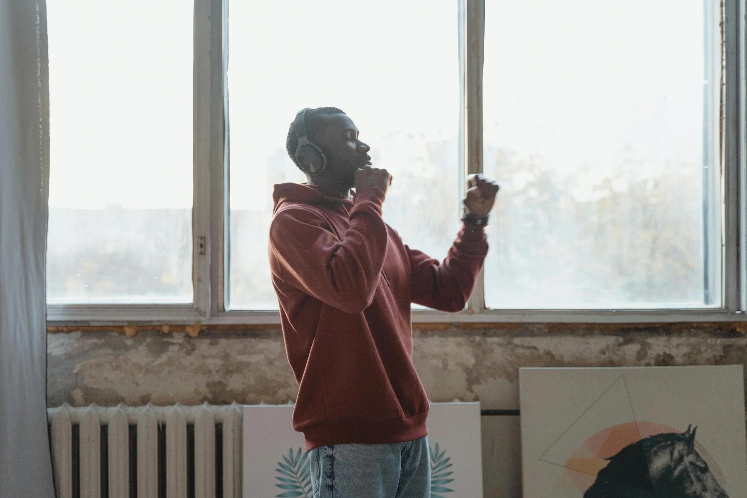 Person dancing at home for mental wellness