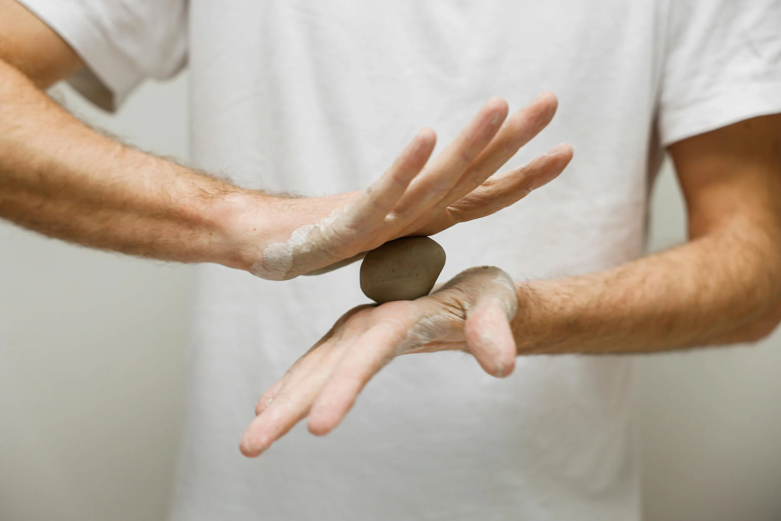 Person working with modeling clay for mental wellness