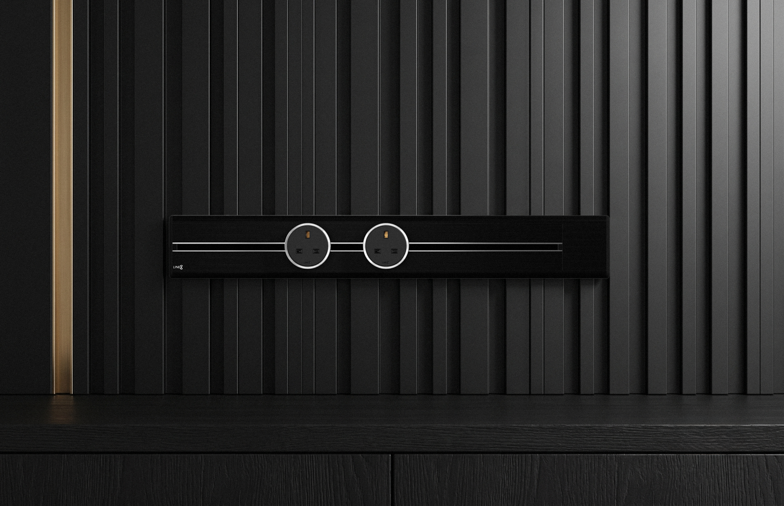 Line8 Model SL power track in Black Hairline hard-anodised finish, shown without ambient lighting. The matte architectural black chassis with contrasting black centre channel and two circular black power adaptors reads as a clean horizontal line against the wall — the anodised aluminium surface itself, with colour converted into the metal.