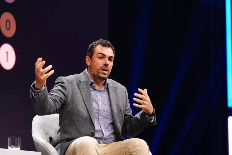 Dr Philip Intallura on a panel stage in Zurich