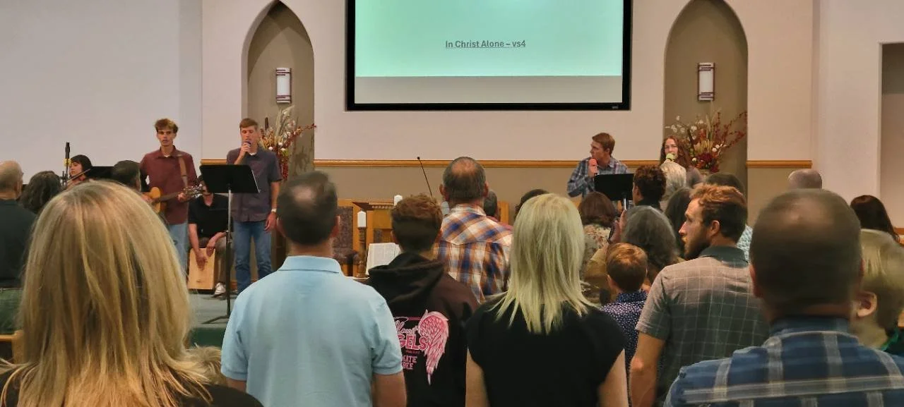 The PBC congregation singing together with the worship team during Sunday service.