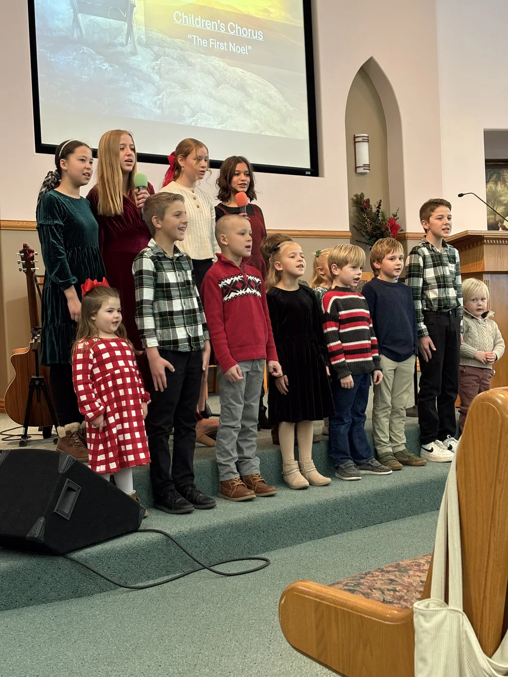The children of PBC singing together.