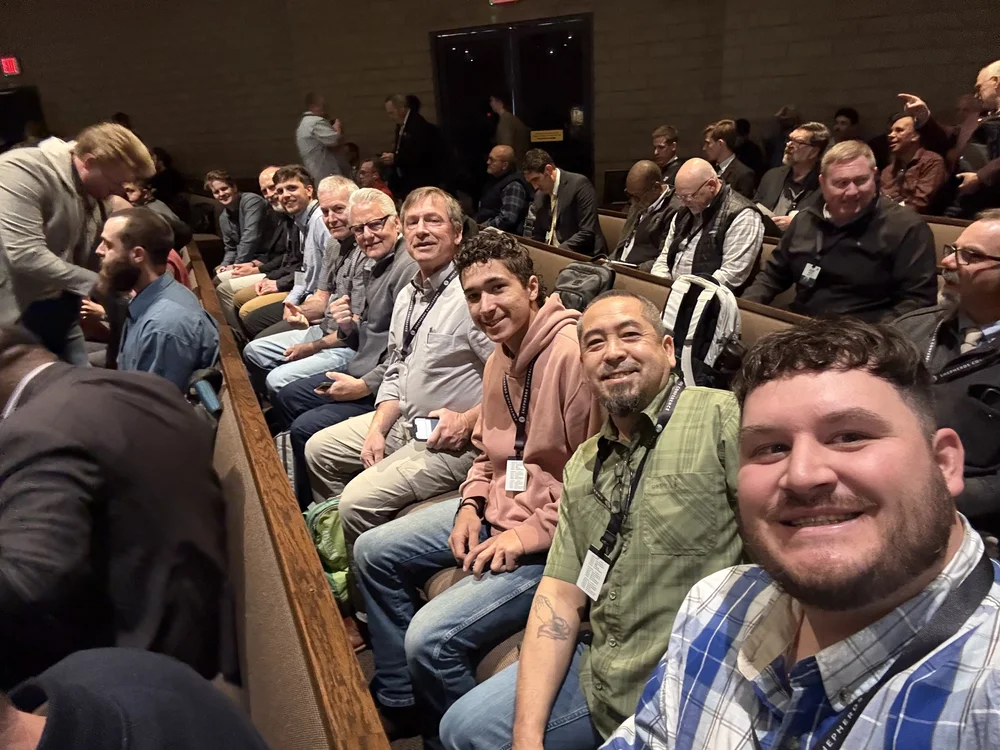 PBC friends seated together at a church conference.