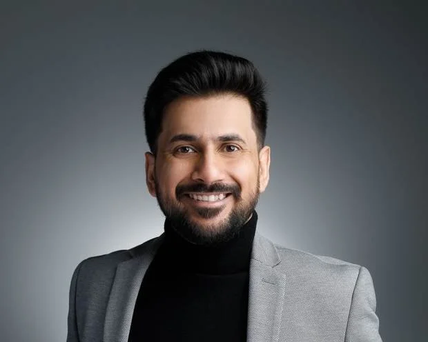 Headshot of Raghav Sehgal, grey background
