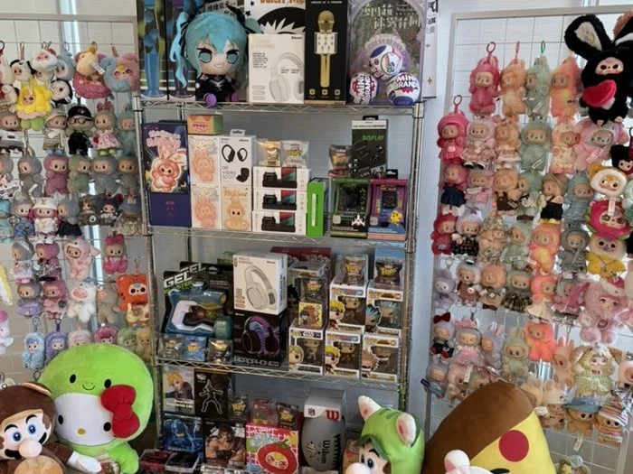 Holiday prize display: plush characters and mystery boxes