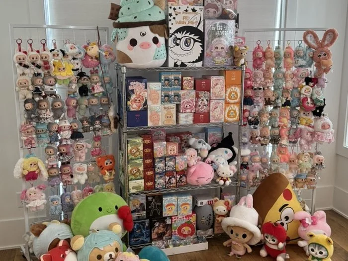 Close-up of Christmas prize items and blind boxes on display
