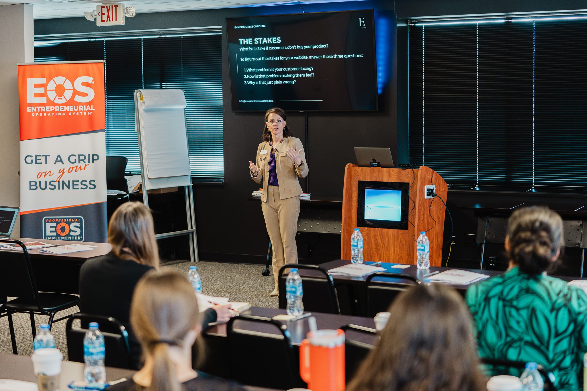  Hailey teaching a room of people about AI