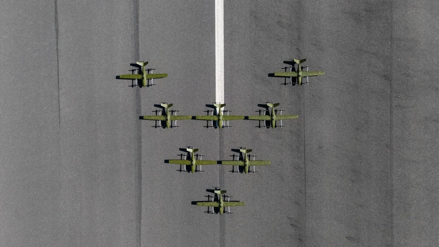 A drone flying above a military vehicle during a field exercise.