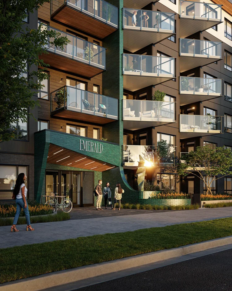 Residential building entrance with green metal balconies and timber soffits