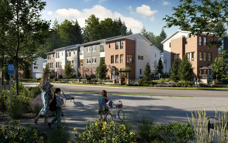 Townhome community street in brick and light cladding