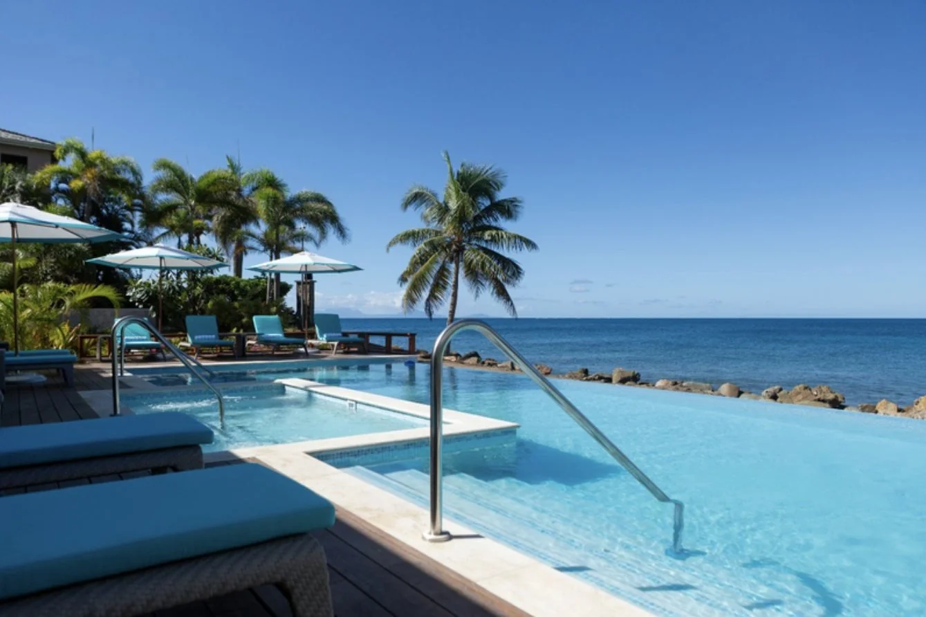 The infinity pool at Curtain Bluff overlooking the sea