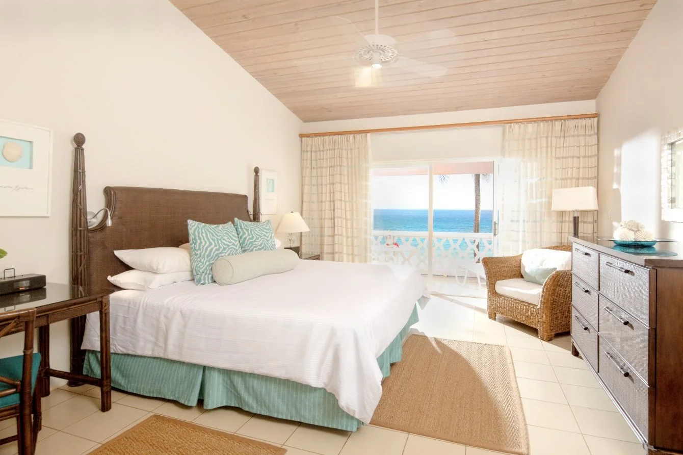 A Deluxe Room with king bed and sea-view veranda