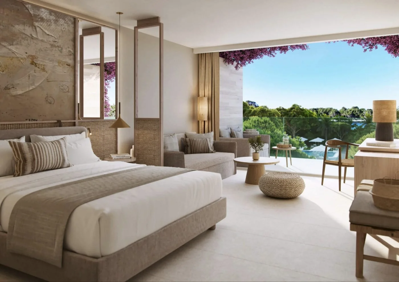 A Junior Suite with a bed and sofa opening onto a balcony framed by bougainvillea