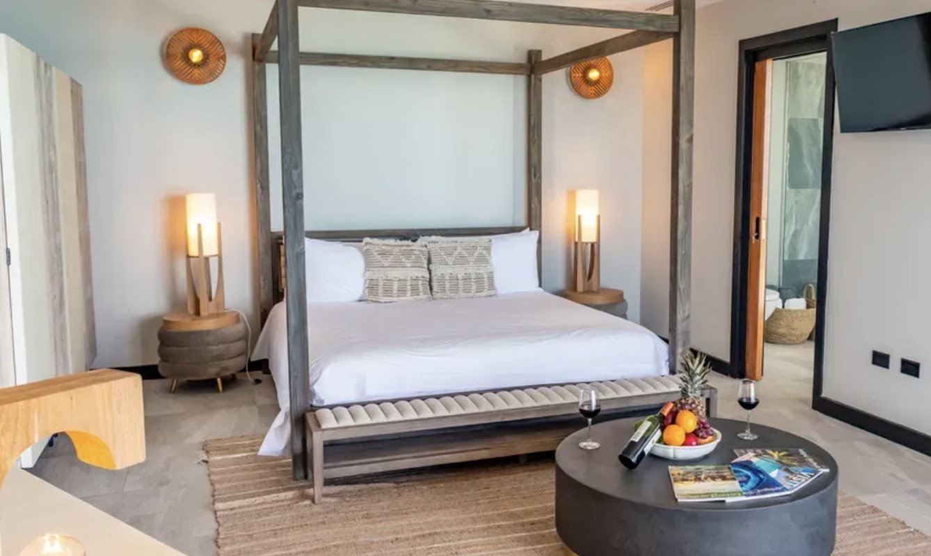 A bedroom with four-poster bed