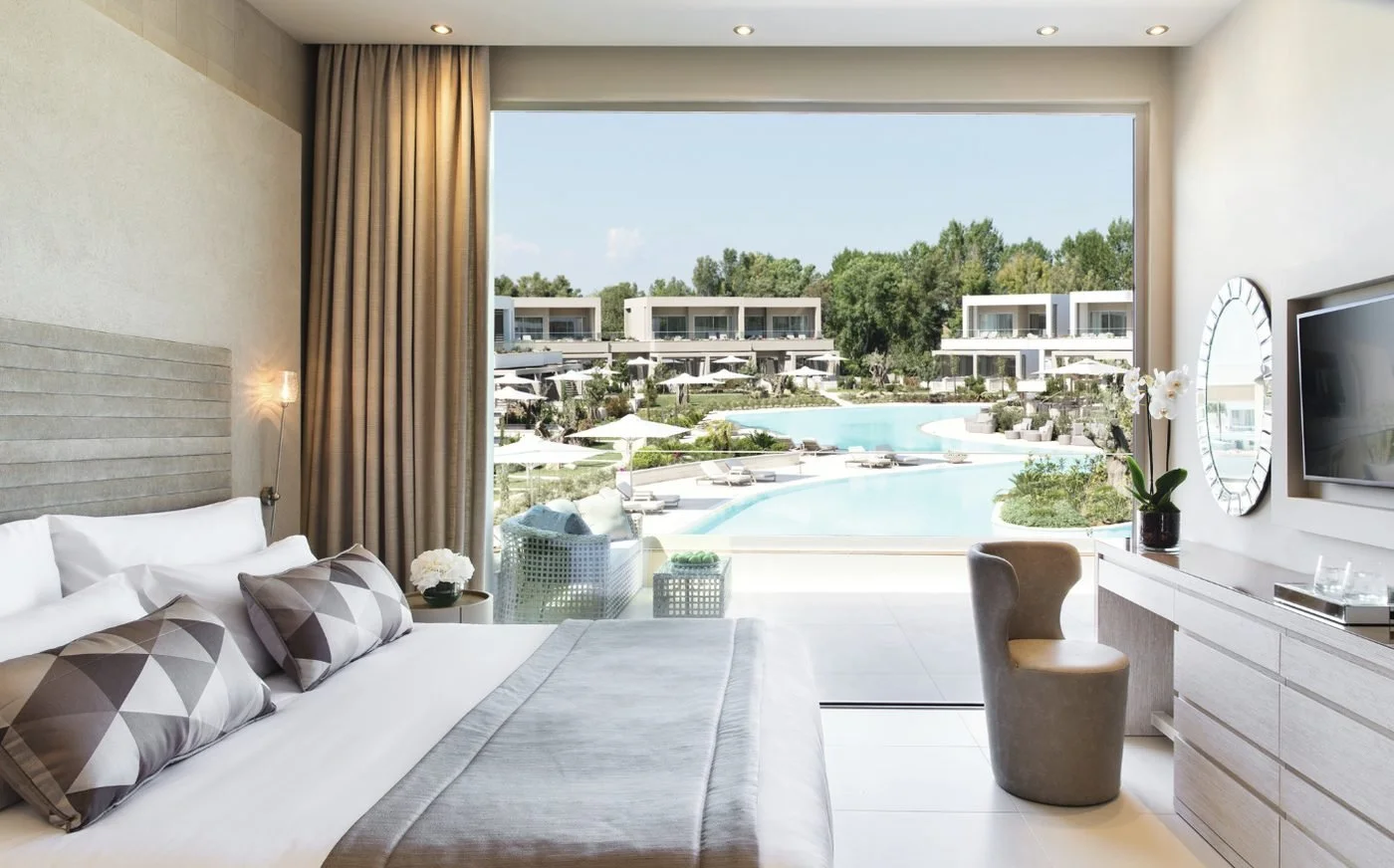 A One Bedroom Suite Grand Balcony at Sani Dunes looking out over the lagoon pool