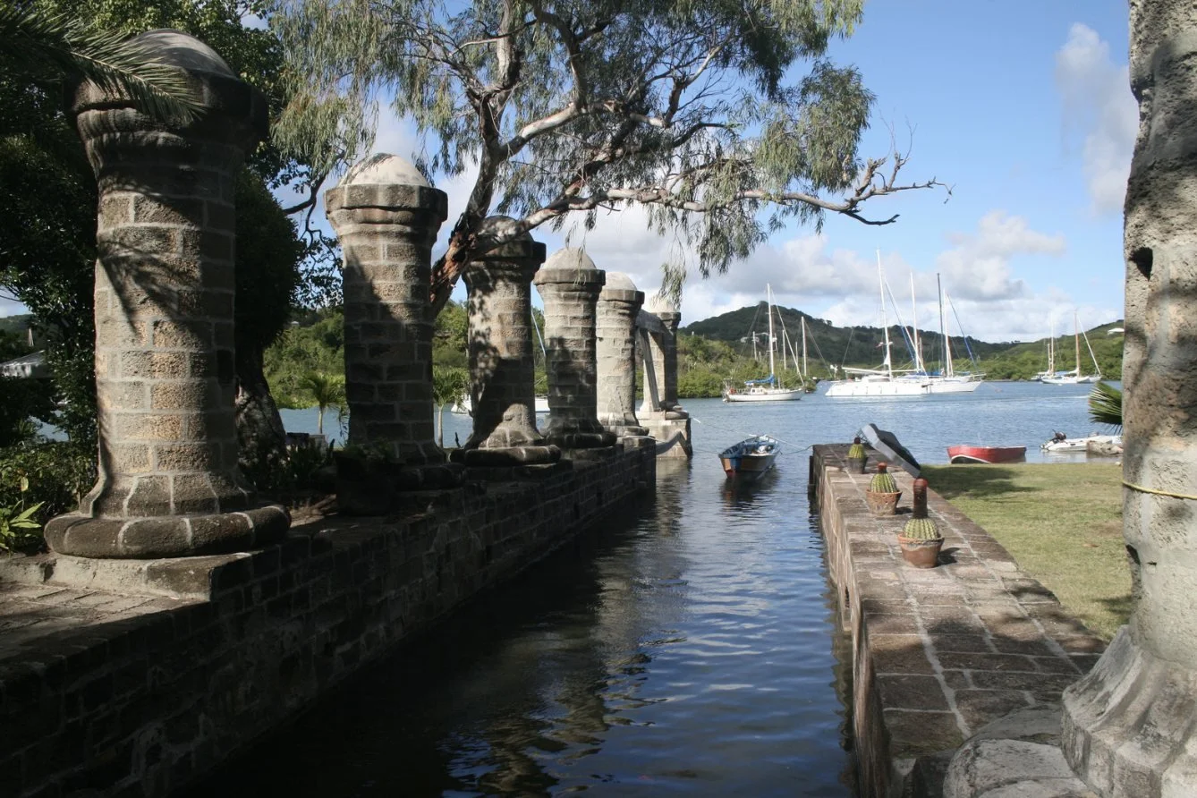 Historic stone pillars beside the water at Nelson's Dockyard