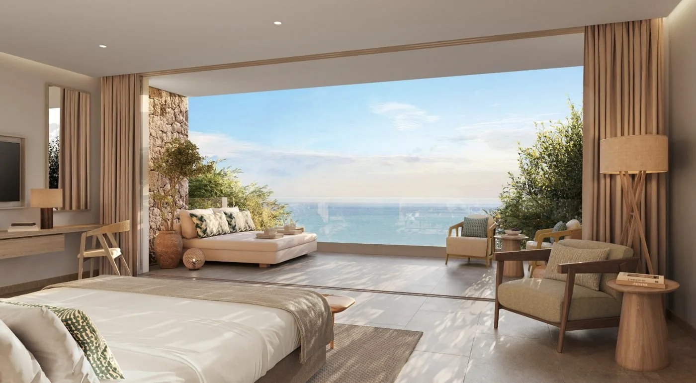 Artist's impression of a bedroom in a Deluxe Three Bedroom Villa, opening onto a terrace with a daybed and the sea