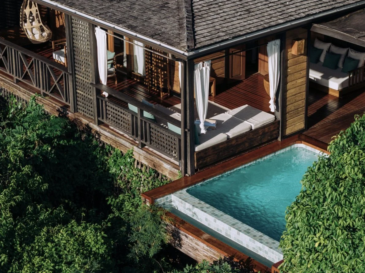 A garden villa with its private pool among tropical foliage