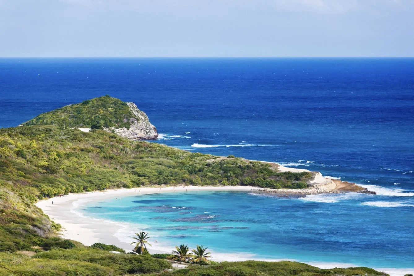The curve of Half Moon Bay on Antigua's Atlantic coast
