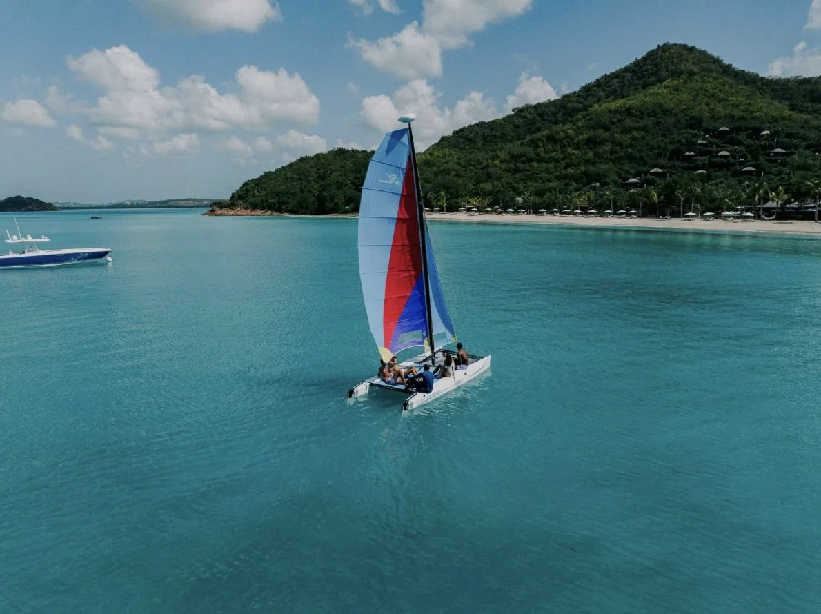 A Hobie Cat sailing in the bay