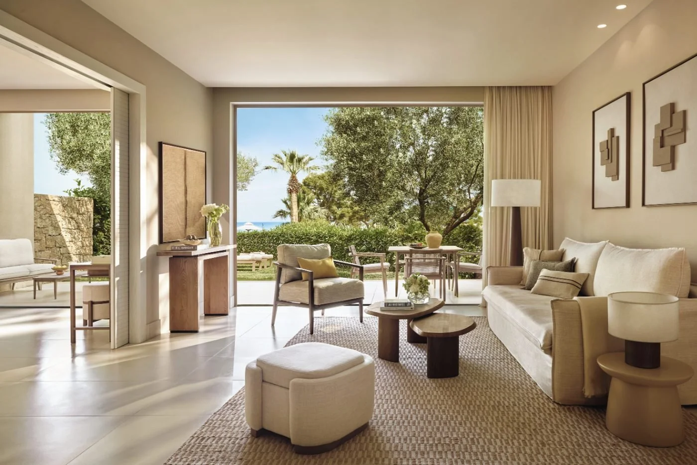 Living area of a One Bedroom Bungalow Suite at Sani Club opening onto its private garden