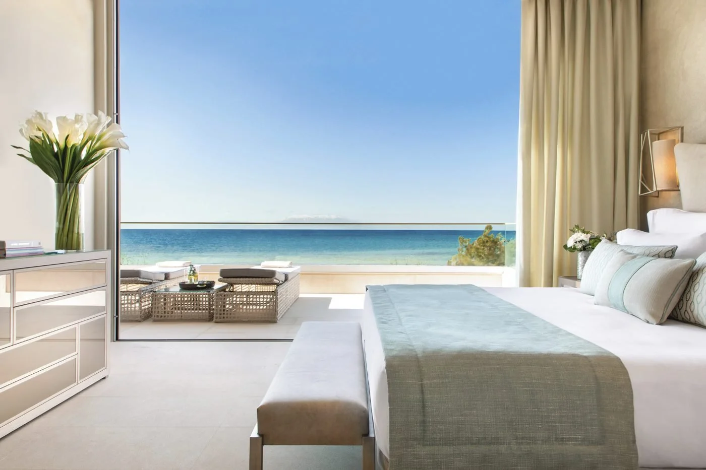 A beach front suite at Sani Dunes opening onto a balcony and the sea