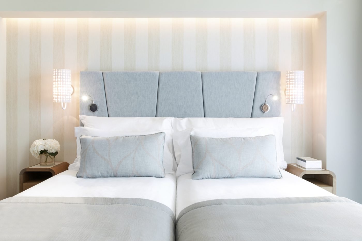 A Double Room at Ikos Dassia with twin beds made up in white and pale blue linen