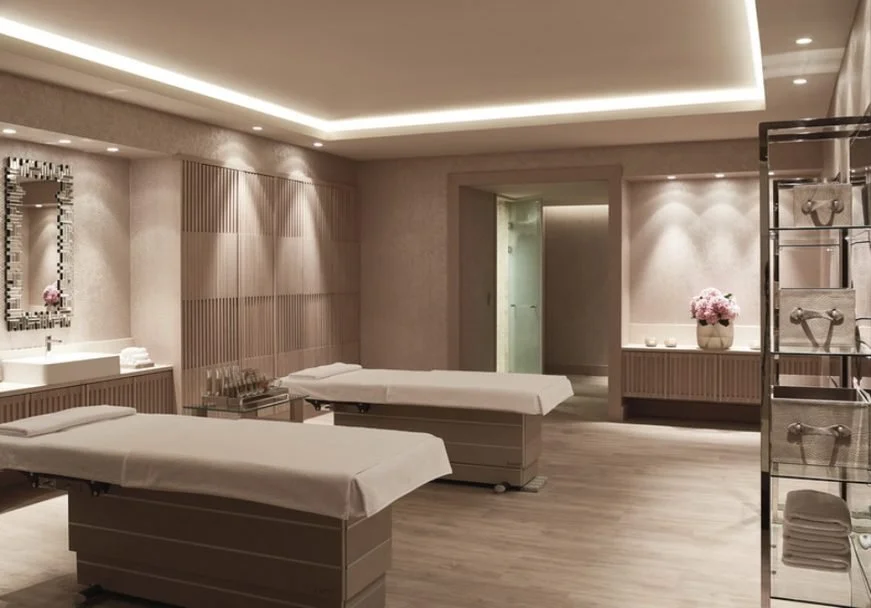 A softly lit double treatment room at the D Spa, Sani Dunes