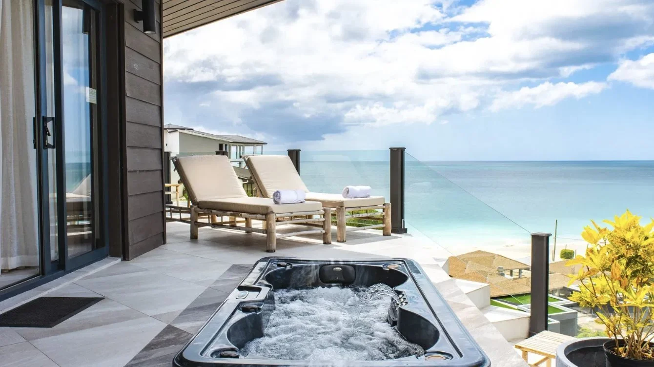 A terrace jacuzzi looking out to sea
