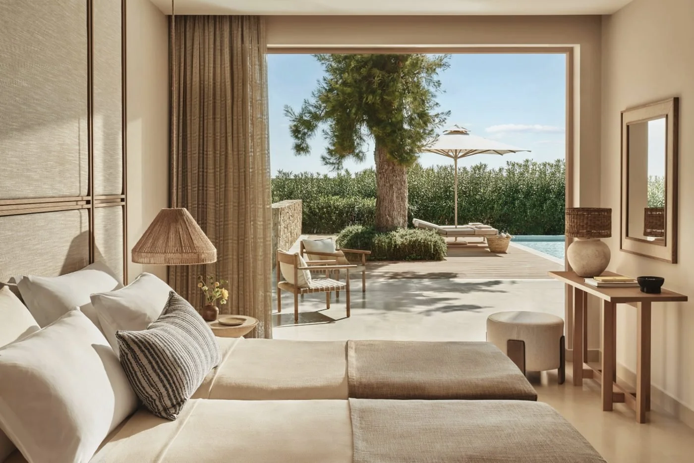 A twin bedroom in a Deluxe Two Bedroom Bungalow Suite Private Pool looking out to its terrace and pool