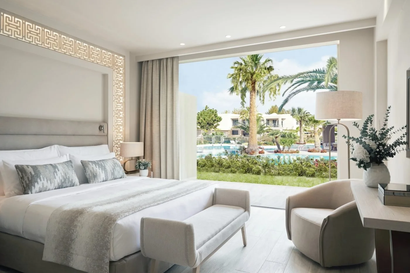 A bedroom in a Family Suite Private Garden opening onto a lawn, palm trees and the Porto Sani pools