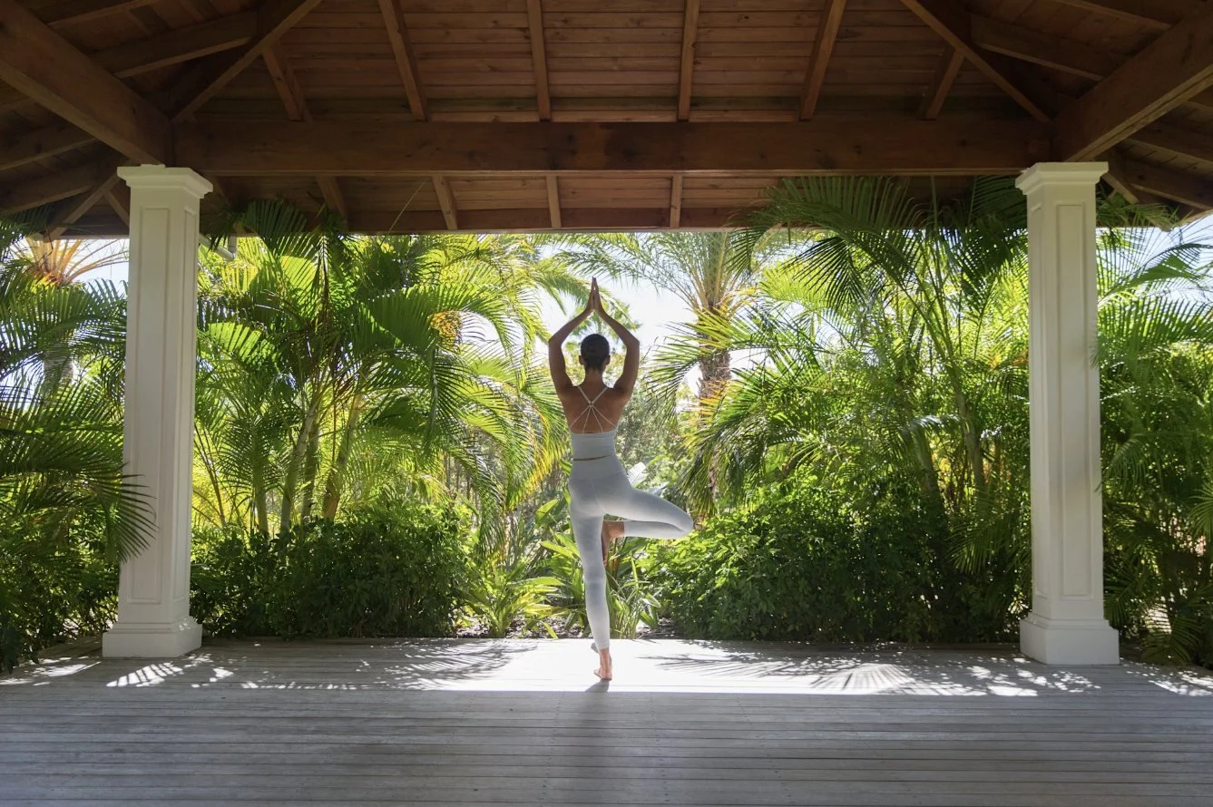 Yoga in an open garden pavilion